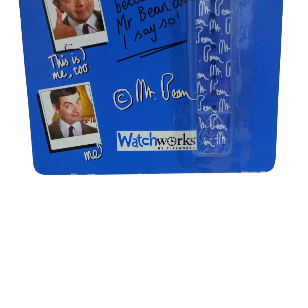 A blue collectible sign featuring signed autographs and printed photos of Mr. Bean, displayed on a white background.