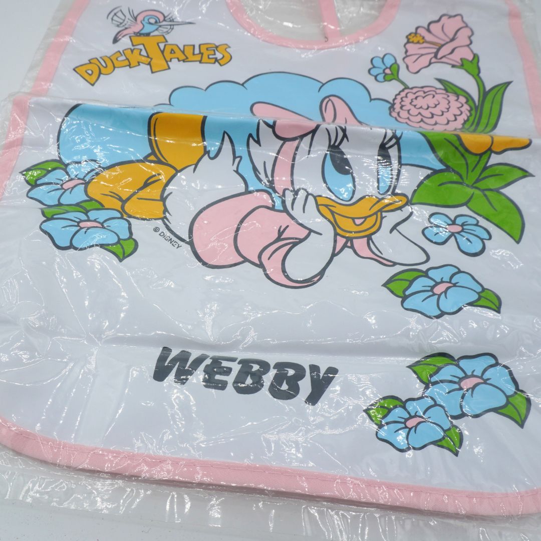 Cartoon character bib with 'DuckTales' branding and 'Webby' text on a floral background.