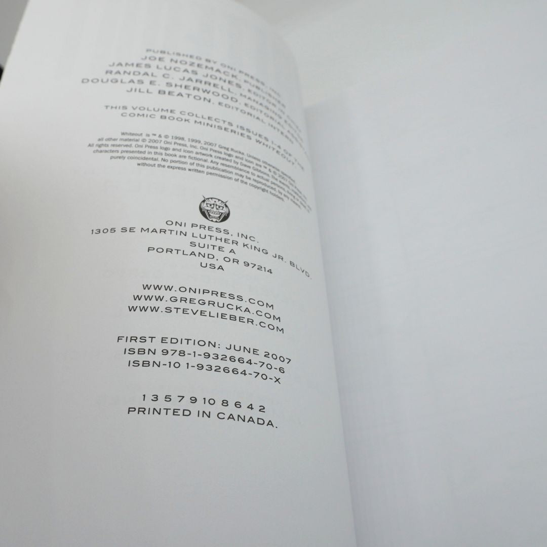 The publishing page for Whiteout Volume 1, with black text on white paper
