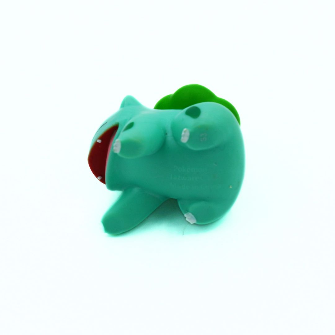 Green cartoon-like character with a red interior on a white background