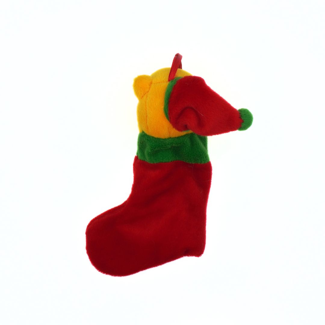 Red dog toy with yellow body and green accents on a white background