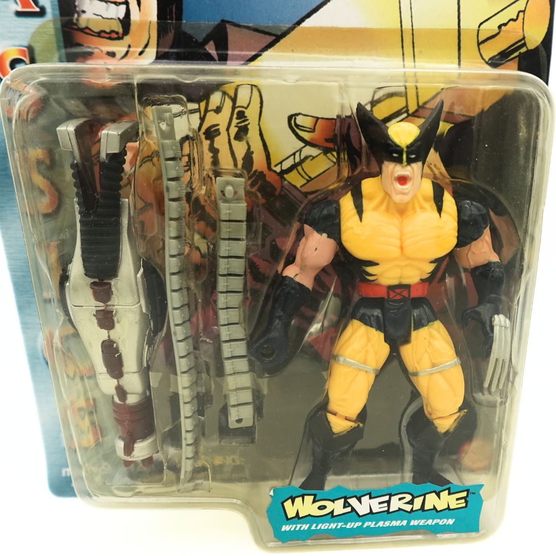 A close up of the Wolverine Classics figure in its packaging wearing a yellow and black outfit