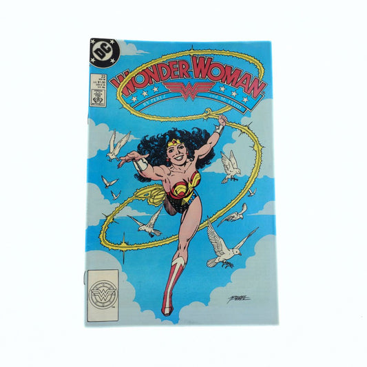 Comic book cover featuring Wonder Woman flying with a lasso against a blue sky.