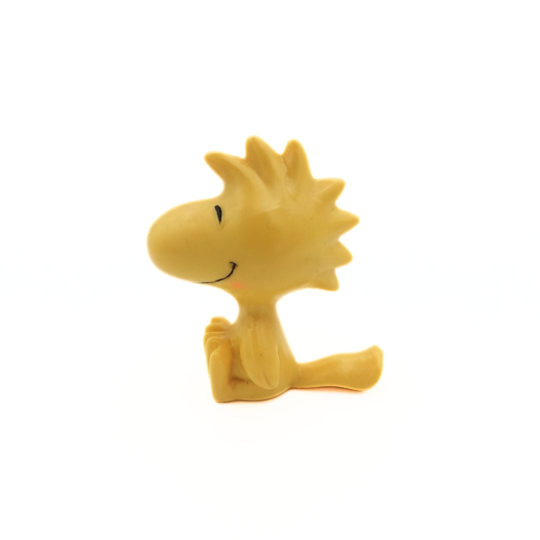 Yellow PVC figurine of Woodstock from Peanuts