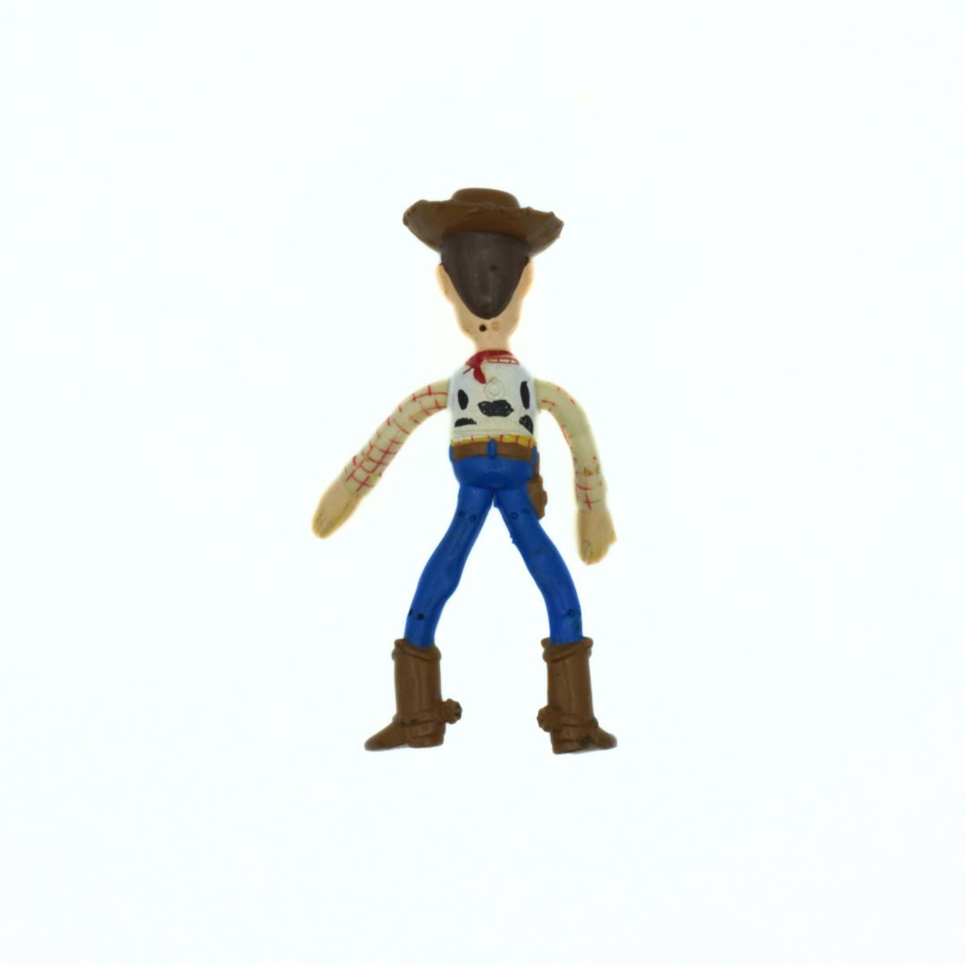 Toy figure of a cowboy character on a white background