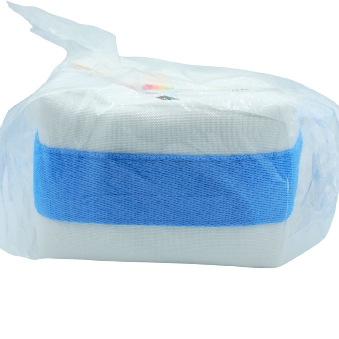 A white rectangular fabric item wrapped in a clear plastic bag, secured with a wide blue elastic band, on a plain white background.