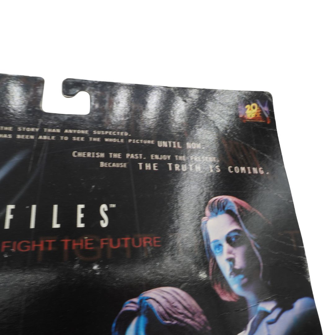 Product packaging with a character from a movie or TV show, featuring text and a dark background.