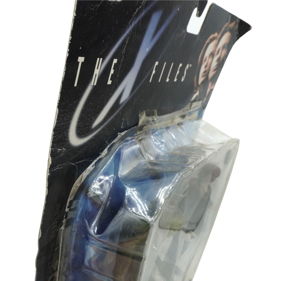 Packaged product with 'The X Files' branding on a white background