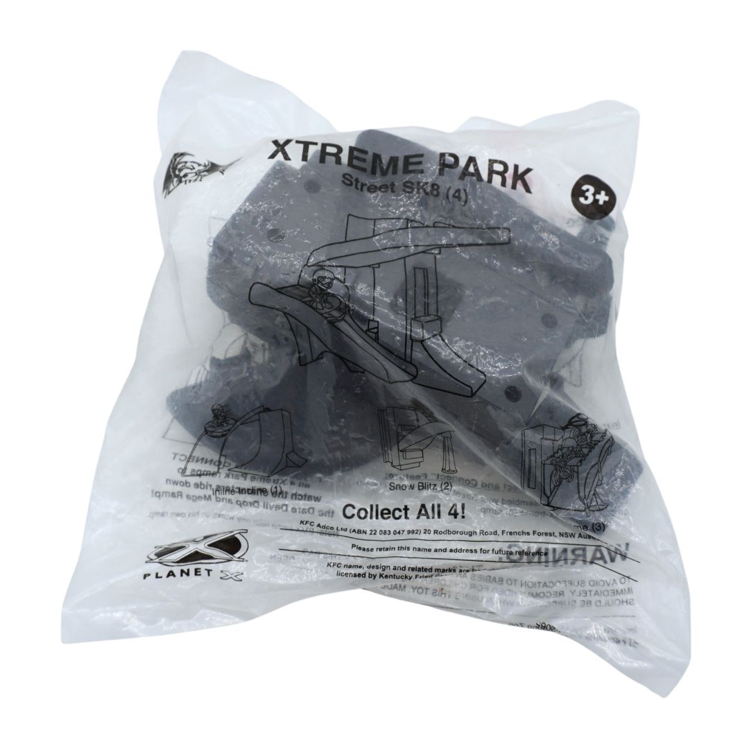 A sealed clear plastic bag containing a set of dark gray plastic toy parts with printed black text and line drawings, including 'XTREME PARK Street SK8 (4)' and 'Planet USA'.