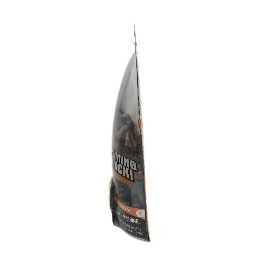 Side on photo of the Spinning Attack Yoda figurine in packaging