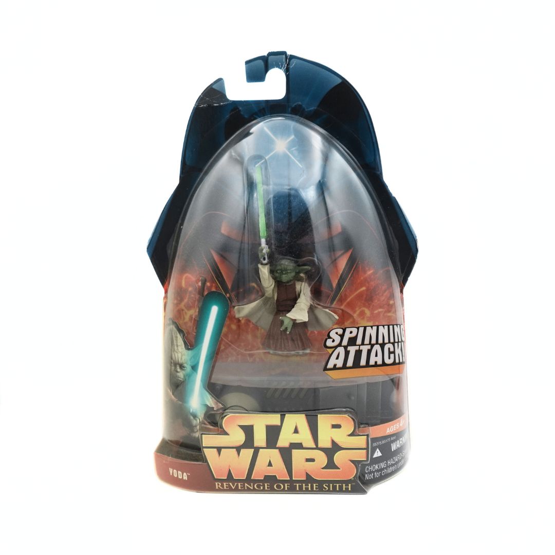 Image of a Yoda Revenge of the Sith Star War figurine with a spinning attack feature, still in its packaging