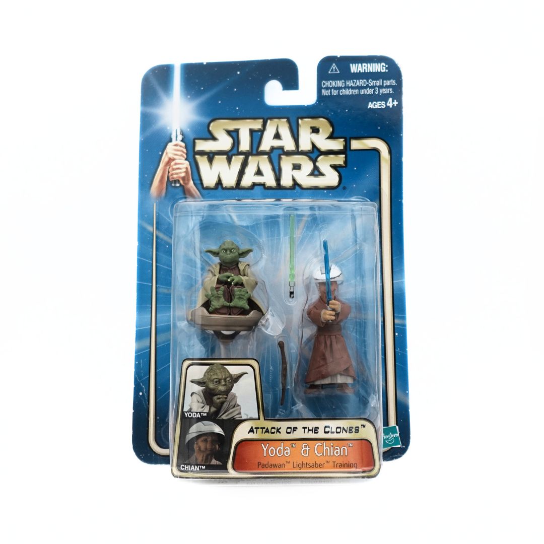 Front on photo of a 2002 Yoda and Chian figure set, with a green lightsaber, blue lightsaber and brown stick accessories