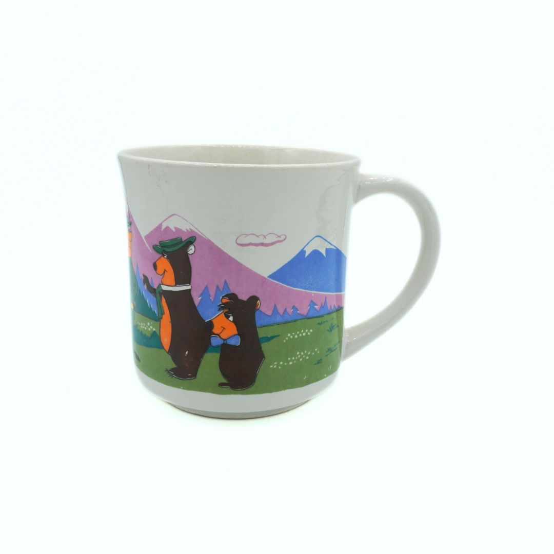 Mug with bear design and mountain landscape on a white background