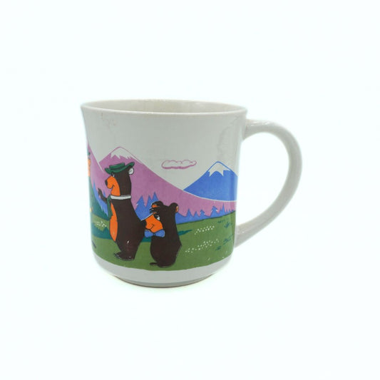 Mug with bear design and mountain landscape on a white background