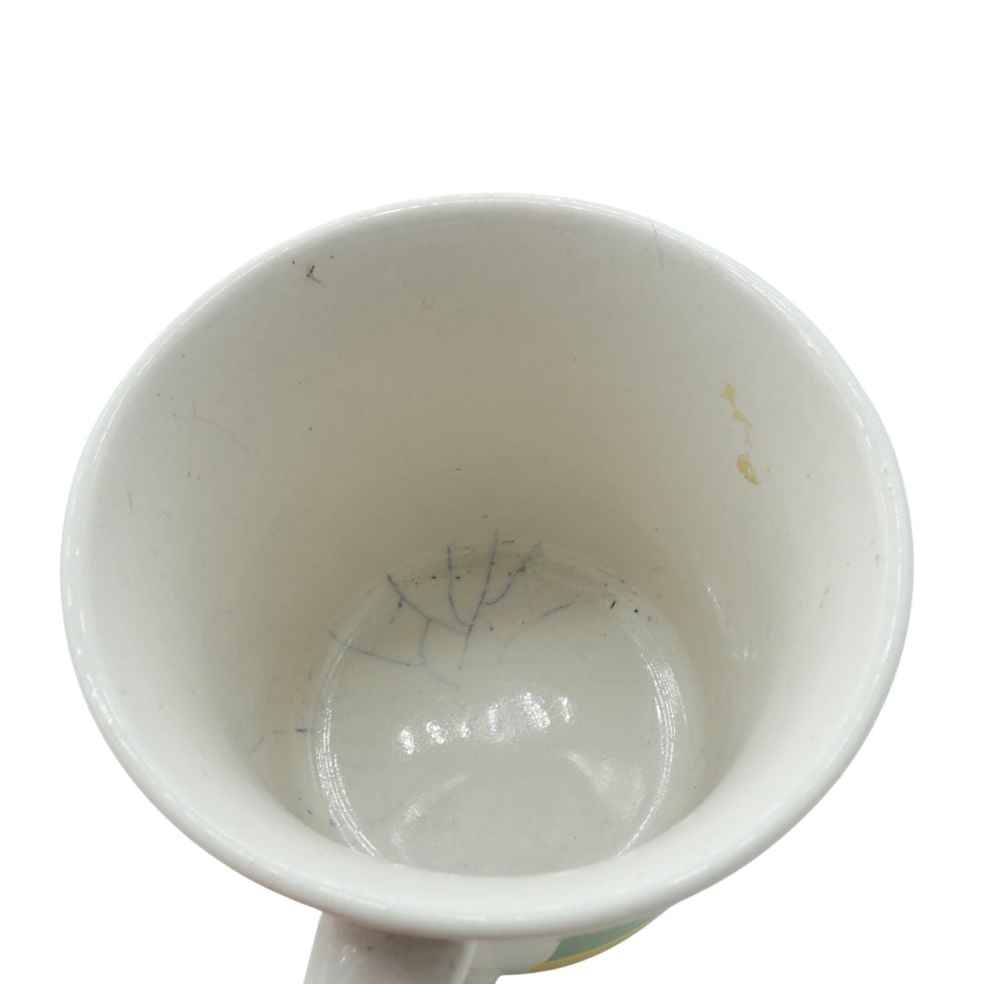 White ceramic cup with cracks inside on a white background