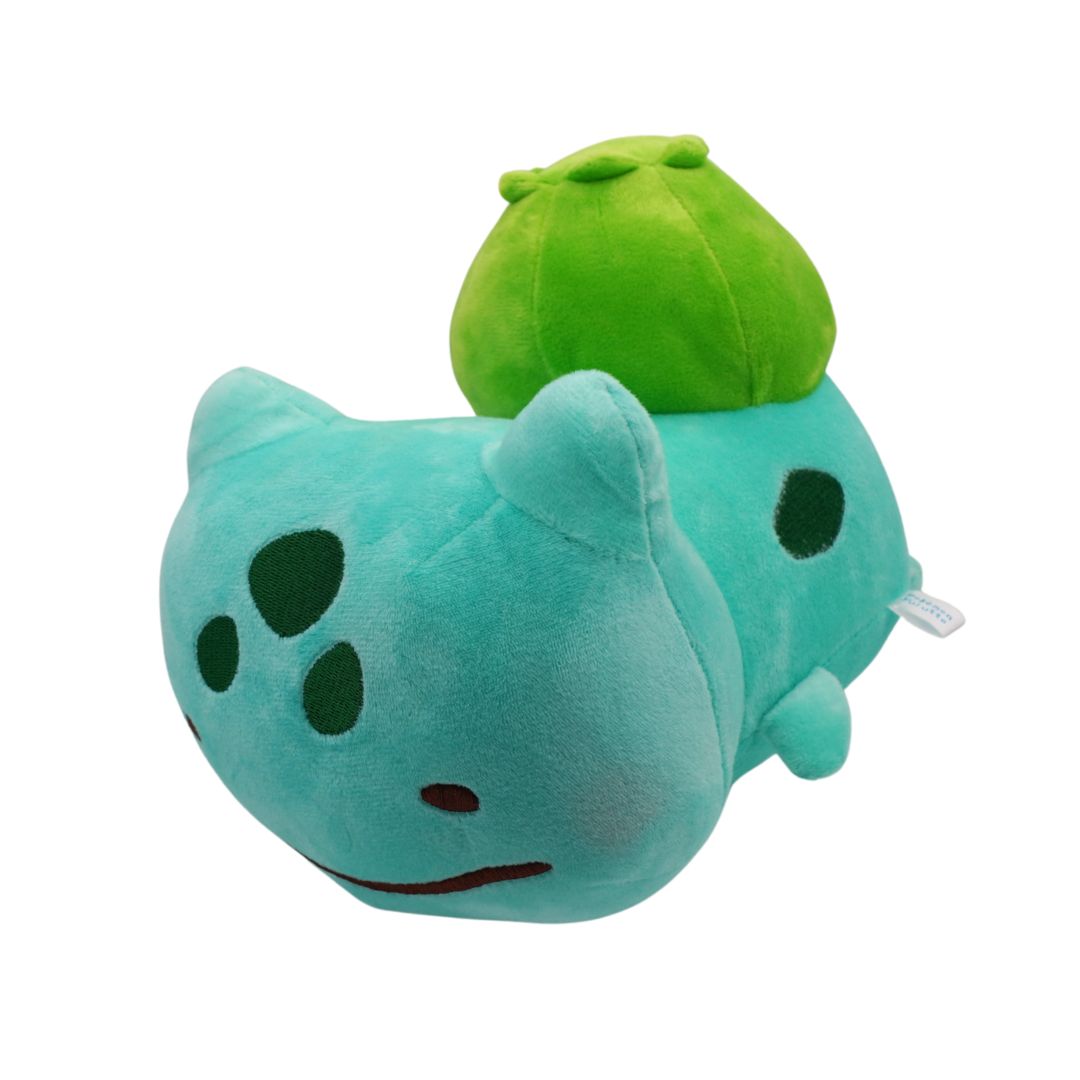 Plush toy with a green top and blue body on a white background