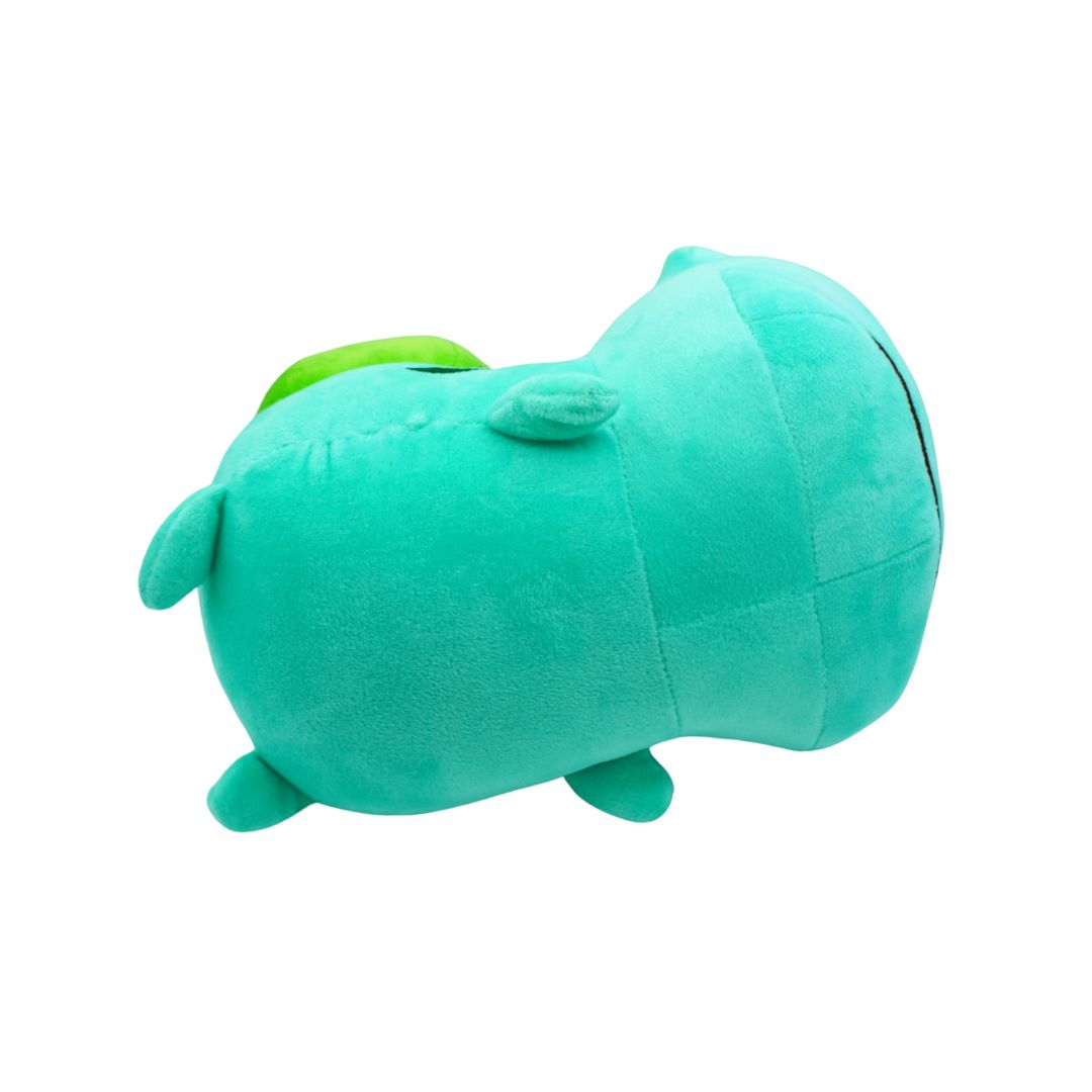 Green plush toy on a white background