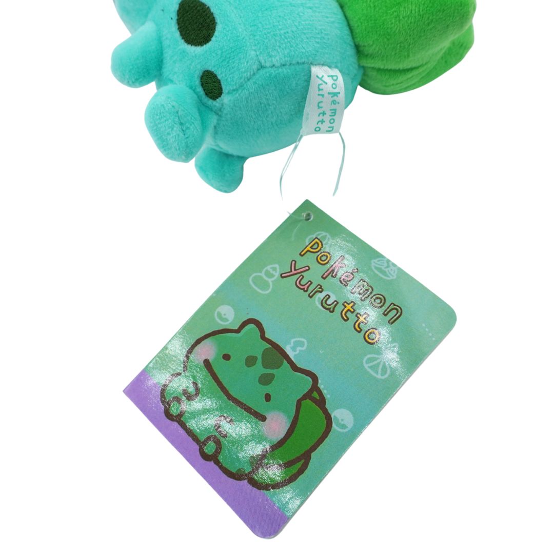 Green plush toy with a tag labeled 'Pokémon Yurutto' on a white background