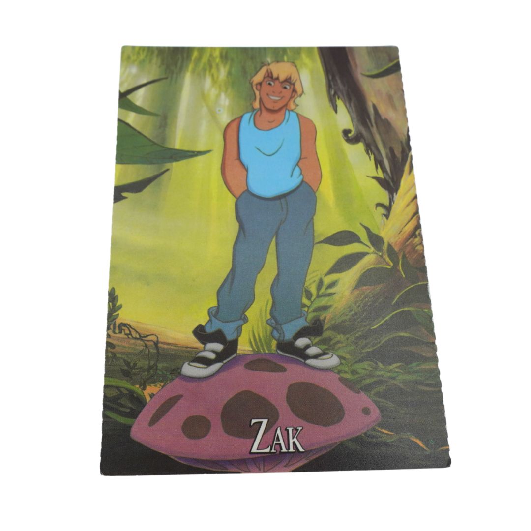 A rectangular printed card or cover featuring an illustrated blond man standing on a pink mushroom in a green forest, with the name 'Zak' at the bottom. The item is photographed against a plain white background.