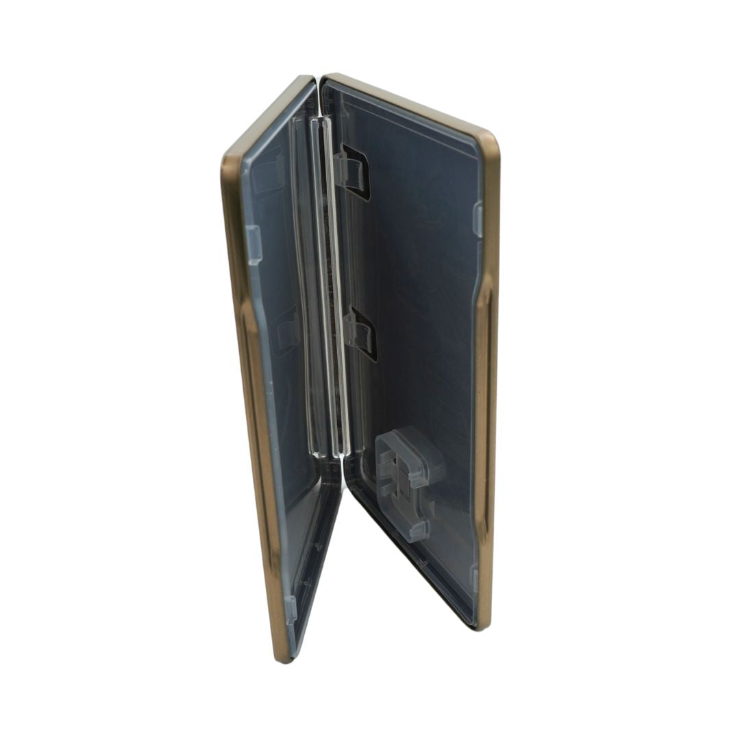 Gold tin case for switch games, with a Tears of the Kingdom Zelda game, showing the plastic lined interior