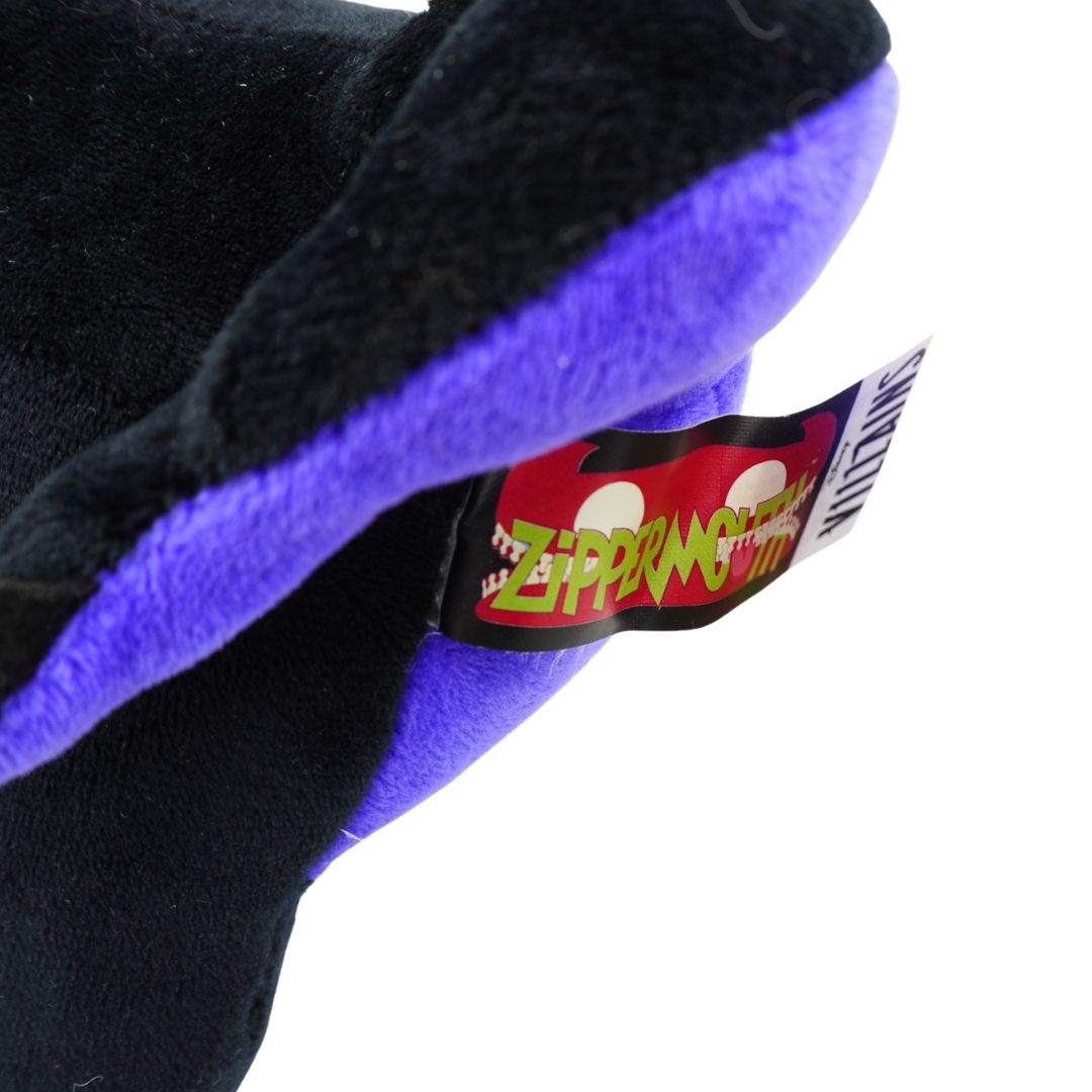 Close-up of a plush toy with a 'Zipper Mouth' label on a white background