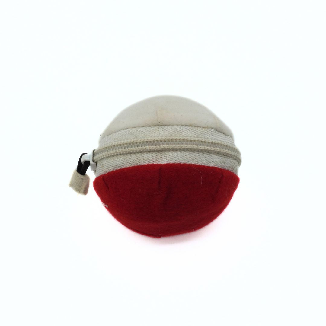 Small round pouch with a zipper, one side red and the other beige, on a white background